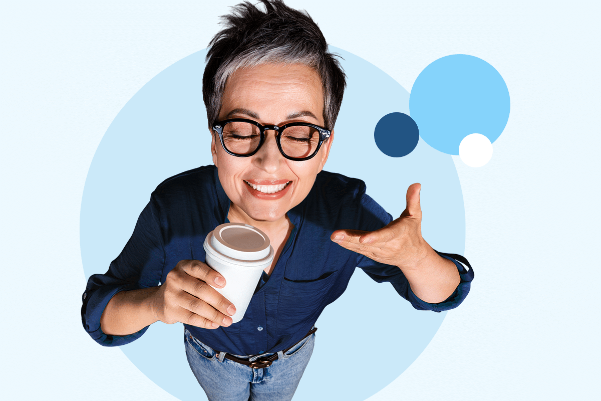 Person holding a takeaway coffee cup with Blue Rewards–themed graphics in the background